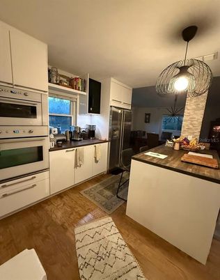 Dining room, Interior, Kitchen, Pendant Lights, Stainless Steel Appliances, Wood Texture Flooring