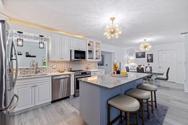 Dining room, Interior, Kitchen, Pendant Lights, Stainless Steel Appliances, Wood Texture Flooring