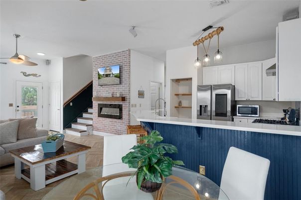 Fireplace, Interior, Kitchen, Living room, Pendant Lights, Recessed Lighting, Stainless Steel Appliances, Stone Walls