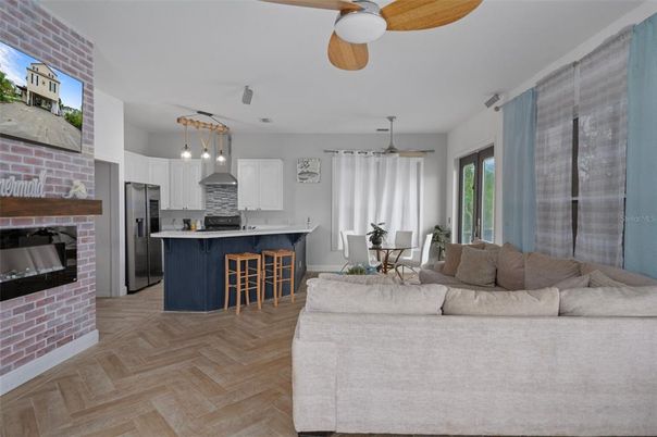 Dining room, Interior, Kitchen, Living room, Pendant Lights, Stainless Steel Appliances, Stone Walls, Wood Texture Flooring