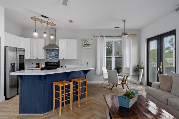 Dining room, Interior, Kitchen, Living room, Pendant Lights, Stainless Steel Appliances, Wood Texture Flooring