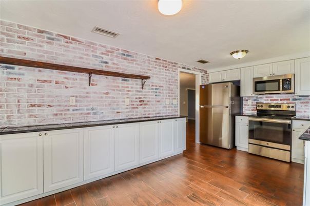 Interior, Kitchen, Stainless Steel Appliances, Stone Walls, Wood Texture Flooring