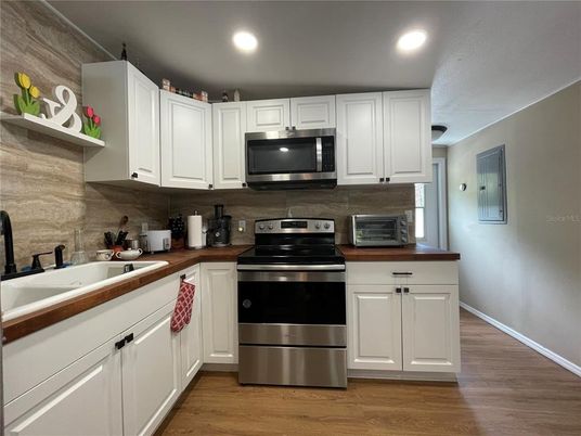 Interior, Kitchen, Recessed Lighting, Stainless Steel Appliances, Wood Texture Flooring