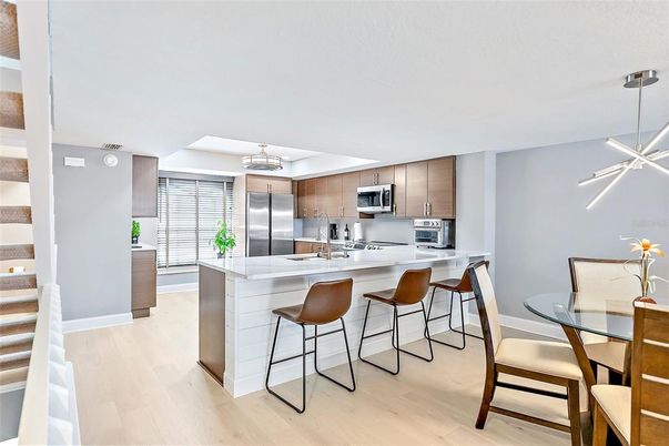 Dining room, Interior, Kitchen, Pendant Lights, Stainless Steel Appliances, Wood Texture Flooring