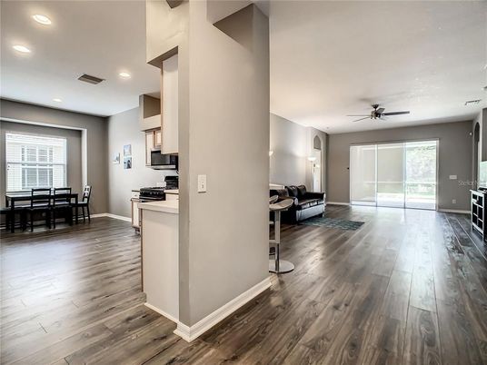 Dining room, Interior, Kitchen, Living room, Recessed Lighting, Stainless Steel Appliances, Wood Texture Flooring