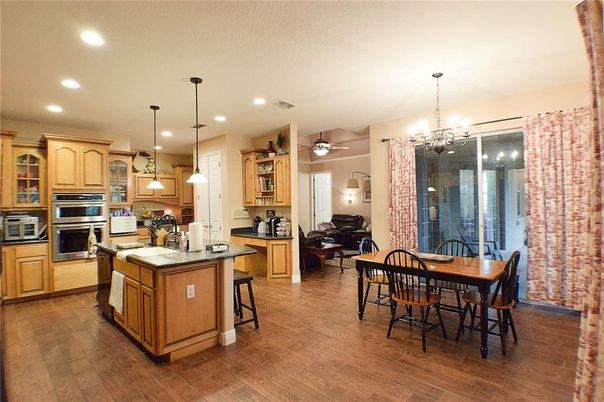 Chandelier, Dining room, Interior, Kitchen, Pendant Lights, Recessed Lighting, Stainless Steel Appliances, Wood Texture Flooring