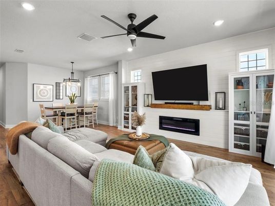 Dining room, Fireplace, Interior, Living room, Pendant Lights, Recessed Lighting, Wood Texture Flooring