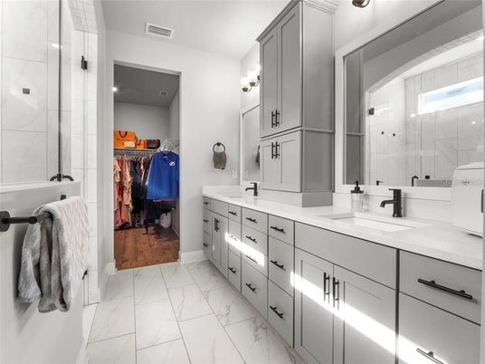 Bathroom, Dual Sink Vanities, Glass Shower, Interior, Marble, Walk-in Closets, Wood Texture Flooring