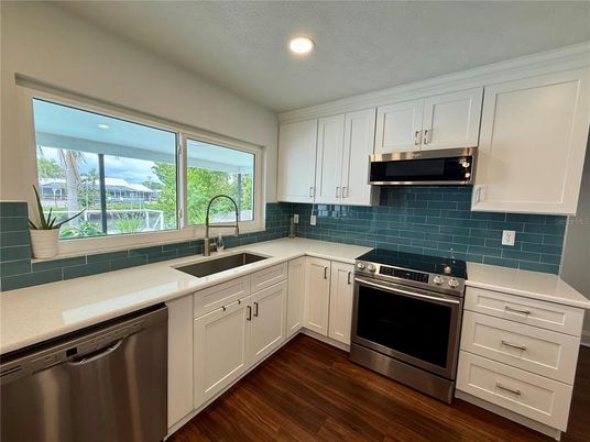 Interior, Kitchen, Recessed Lighting, Stainless Steel Appliances, Wood Texture Flooring