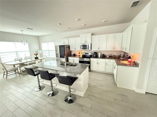 Chandelier, Dining room, Interior, Kitchen, Recessed Lighting, Stainless Steel Appliances, Wood Texture Flooring
