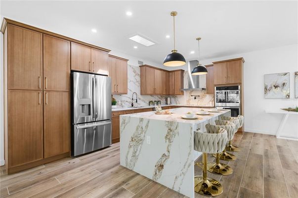 Interior, Kitchen, Marble Walls, Pendant Lights, Recessed Lighting, Stainless Steel Appliances, Wood Texture Flooring