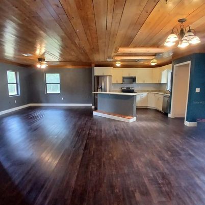 Empty room, Interior, Kitchen, Stainless Steel Appliances, Wooden Ceilings, Wood Texture Flooring