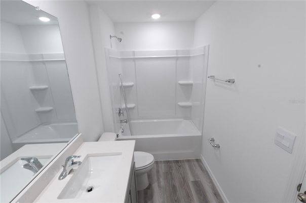 Bathroom, Dual Sink Vanities, Interior, Recessed Lighting, Wood Texture Flooring
