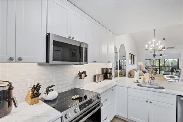 Chandelier, Interior, Kitchen, Pendant Lights, Stainless Steel Appliances, Wood Texture Flooring