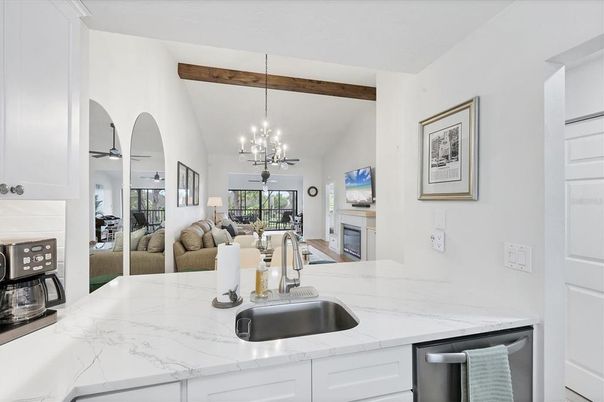 Chandelier, Dining room, Fireplace, Interior, Kitchen, Living room, Pendant Lights, Wooden Beams
