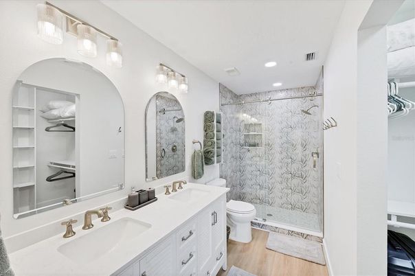 Bathroom, Dual Sink Vanities, Glass Shower, Interior, Recessed Lighting, Wood Texture Flooring