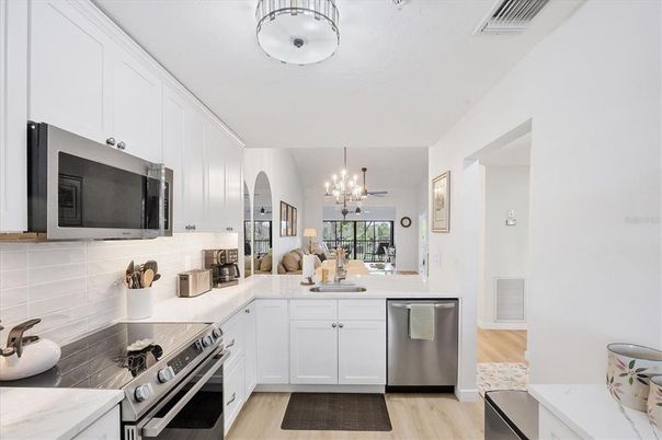 Chandelier, Interior, Kitchen, Pendant Lights, Stainless Steel Appliances, Wood Texture Flooring