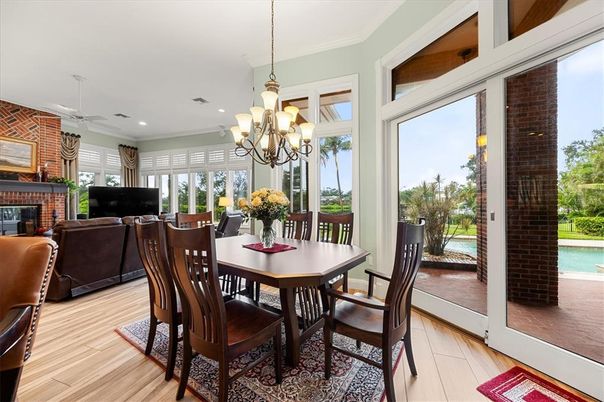 Chandelier, Dining room, Fireplace, Interior, Living room, Recessed Lighting, Stone Walls, Wood Texture Flooring