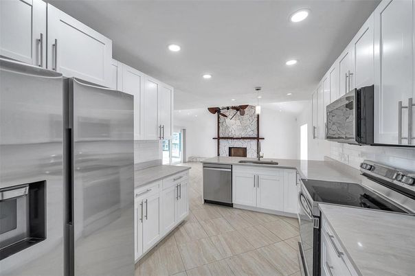 Interior, Kitchen, Pendant Lights, Recessed Lighting, Stainless Steel Appliances, Stone Walls