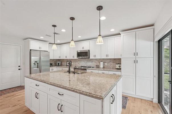 Interior, Kitchen, Pendant Lights, Recessed Lighting, Stainless Steel Appliances, Wood Texture Flooring
