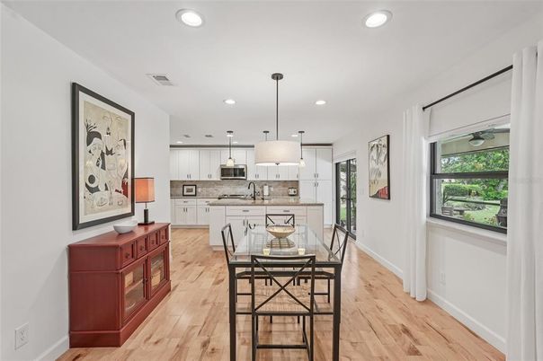 Dining room, Interior, Kitchen, Pendant Lights, Recessed Lighting, Stainless Steel Appliances, Wood Texture Flooring