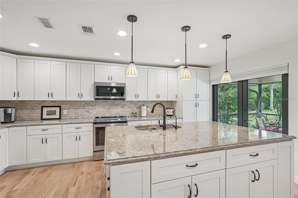 Interior, Kitchen, Pendant Lights, Recessed Lighting, Stainless Steel Appliances, Wood Texture Flooring