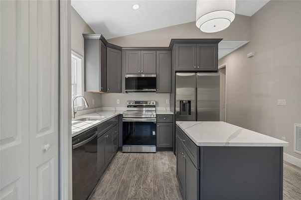 Interior, Kitchen, Recessed Lighting, Stainless Steel Appliances, Wood Texture Flooring