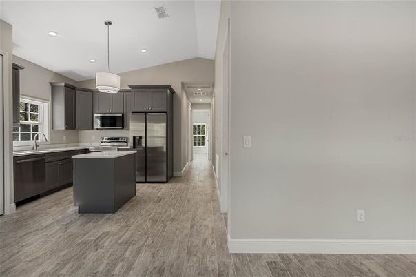 Interior, Kitchen, Pendant Lights, Recessed Lighting, Stainless Steel Appliances, Wood Texture Flooring