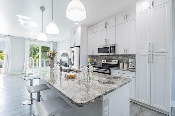 Interior, Kitchen, Pendant Lights, Recessed Lighting, Stainless Steel Appliances, Wood Texture Flooring