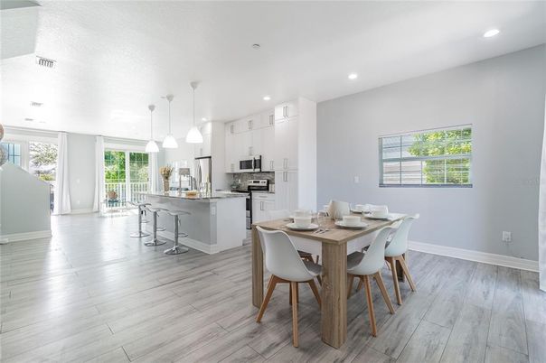 Dining room, Interior, Kitchen, Pendant Lights, Recessed Lighting, Stainless Steel Appliances, Wood Texture Flooring
