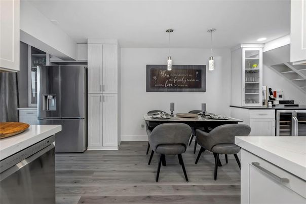 Dining room, Interior, Kitchen, Pendant Lights, Recessed Lighting, Stainless Steel Appliances, Wood Texture Flooring