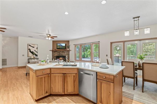 Dining room, Fireplace, Interior, Kitchen, Recessed Lighting, Wood Texture Flooring