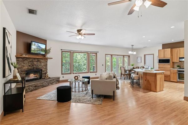Chandelier, Dining room, Fireplace, Interior, Kitchen, Living room, Recessed Lighting, Wood Texture Flooring