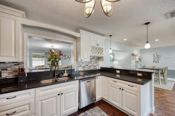 Dining room, Interior, Kitchen, Pendant Lights, Recessed Lighting, Stainless Steel Appliances, Wood Texture Flooring