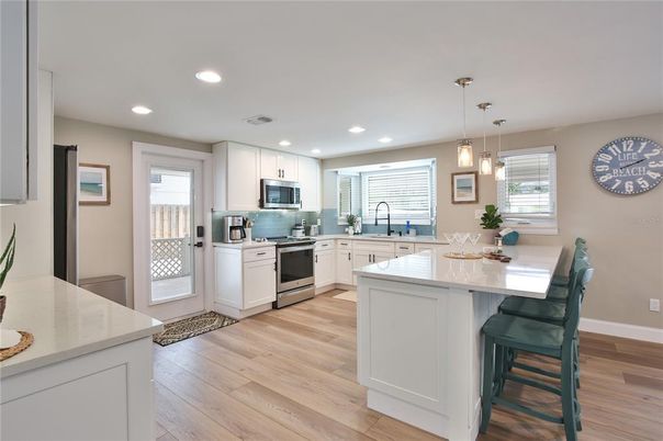 Interior, Kitchen, Pendant Lights, Recessed Lighting, Stainless Steel Appliances, Wood Texture Flooring