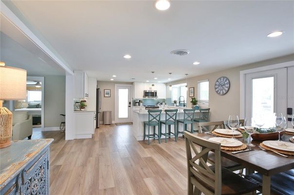 Dining room, Interior, Kitchen, Pendant Lights, Recessed Lighting, Stainless Steel Appliances, Wood Texture Flooring