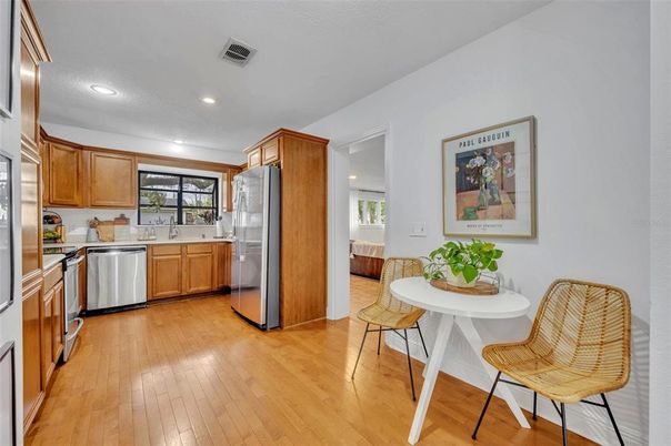 Dining room, Interior, Kitchen, Recessed Lighting, Stainless Steel Appliances, Wood Texture Flooring