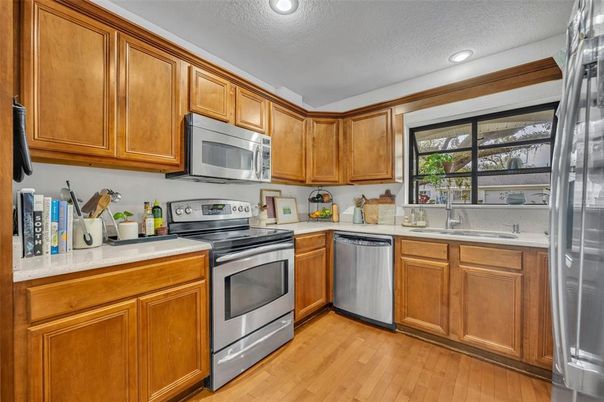 Interior, Kitchen, Recessed Lighting, Stainless Steel Appliances, Wood Texture Flooring