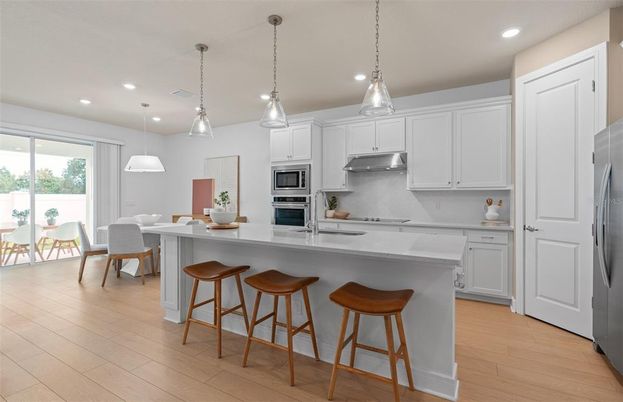 Dining room, Interior, Kitchen, Pendant Lights, Recessed Lighting, Stainless Steel Appliances, Wood Texture Flooring