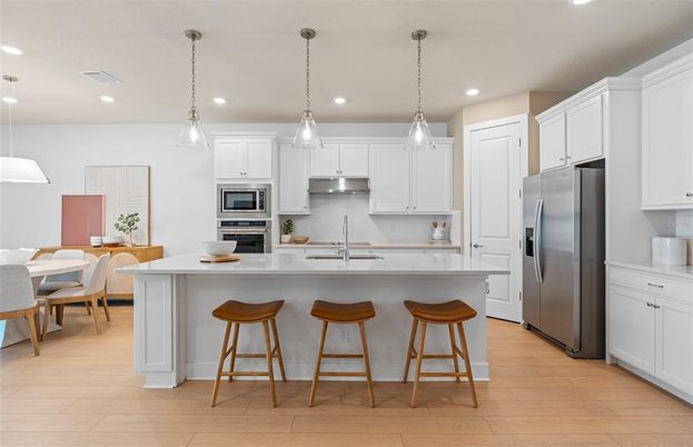 Dining room, Interior, Kitchen, Pendant Lights, Recessed Lighting, Stainless Steel Appliances, Wood Texture Flooring