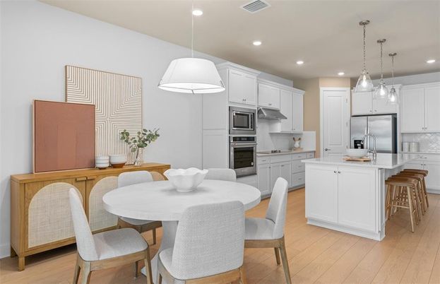 Dining room, Interior, Kitchen, Pendant Lights, Recessed Lighting, Stainless Steel Appliances, Wood Texture Flooring