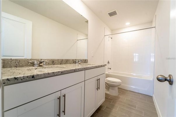 Bathroom, Dual Sink Vanities, Interior, Recessed Lighting, Wood Texture Flooring