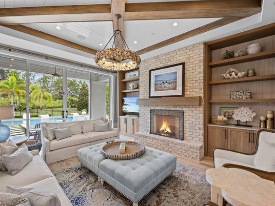Chandelier, Fireplace, Interior, Living room, Recessed Lighting, Stone Walls, Wooden Beams, Wood Texture Flooring
