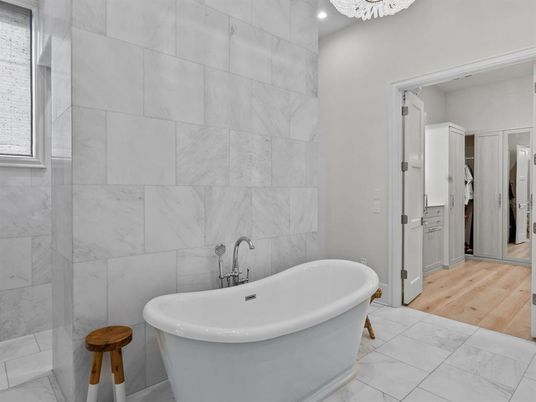 Bathroom, Free Standing Baths, Interior, Marble, Marble Walls, Recessed Lighting, Wood Texture Flooring