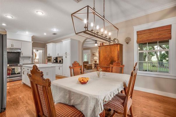 Dining room, Interior, Kitchen, Pendant Lights, Recessed Lighting, Stainless Steel Appliances, Wood Texture Flooring