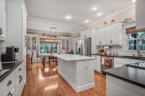 Dining room, Interior, Kitchen, Pendant Lights, Recessed Lighting, Stainless Steel Appliances, Wood Texture Flooring