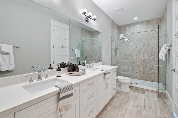 Bathroom, Dual Sink Vanities, Glass Shower, Interior, Recessed Lighting, Wood Texture Flooring
