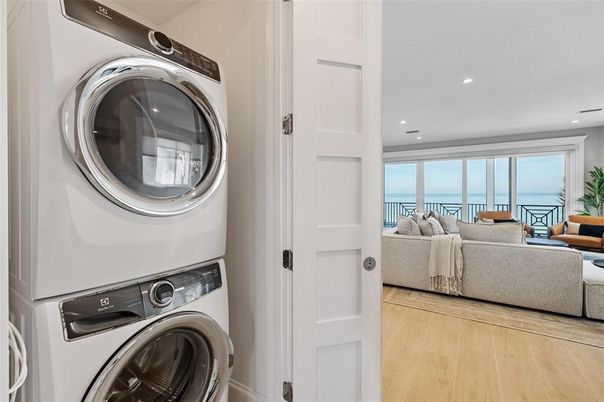 Bedroom, Interior, Living room, Recessed Lighting, Utility Closets, Washer, Water, Wood Texture Flooring
