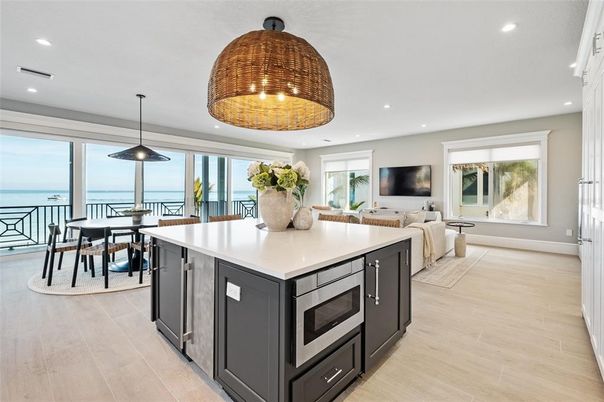 Dining room, Interior, Kitchen, Living room, Pendant Lights, Recessed Lighting, Stainless Steel Appliances, Water, Wood Texture Flooring