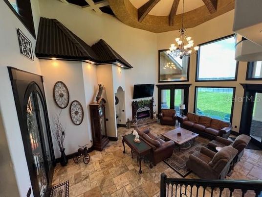 Chandelier, Fireplace, Interior, Living room, Wooden Beams